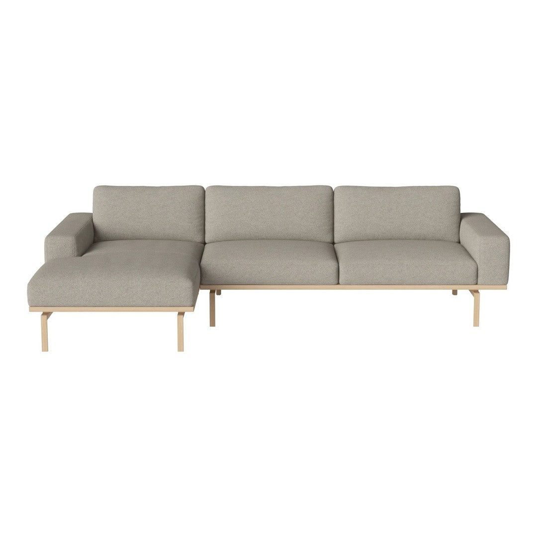 Modern gray sectional sofa with a clean, minimalist design and natural wood legs, perfect for contemporary decor.