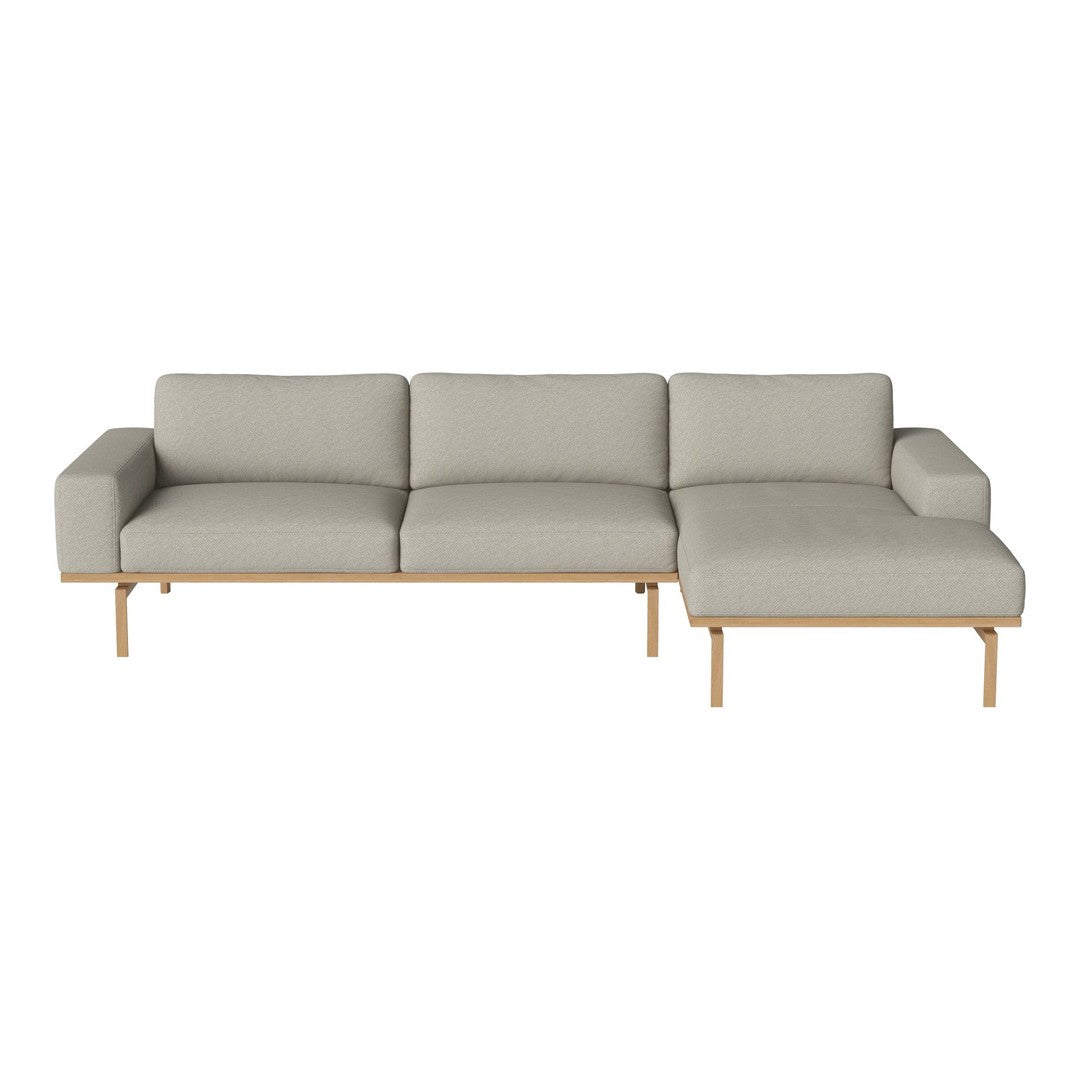 Light gray modern sectional sofa with a minimalist design and natural wood legs, ideal for contemporary living spaces.