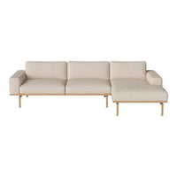 Neutral beige sectional sofa with clean lines and a minimalist design, featuring textured upholstery and light wooden legs.