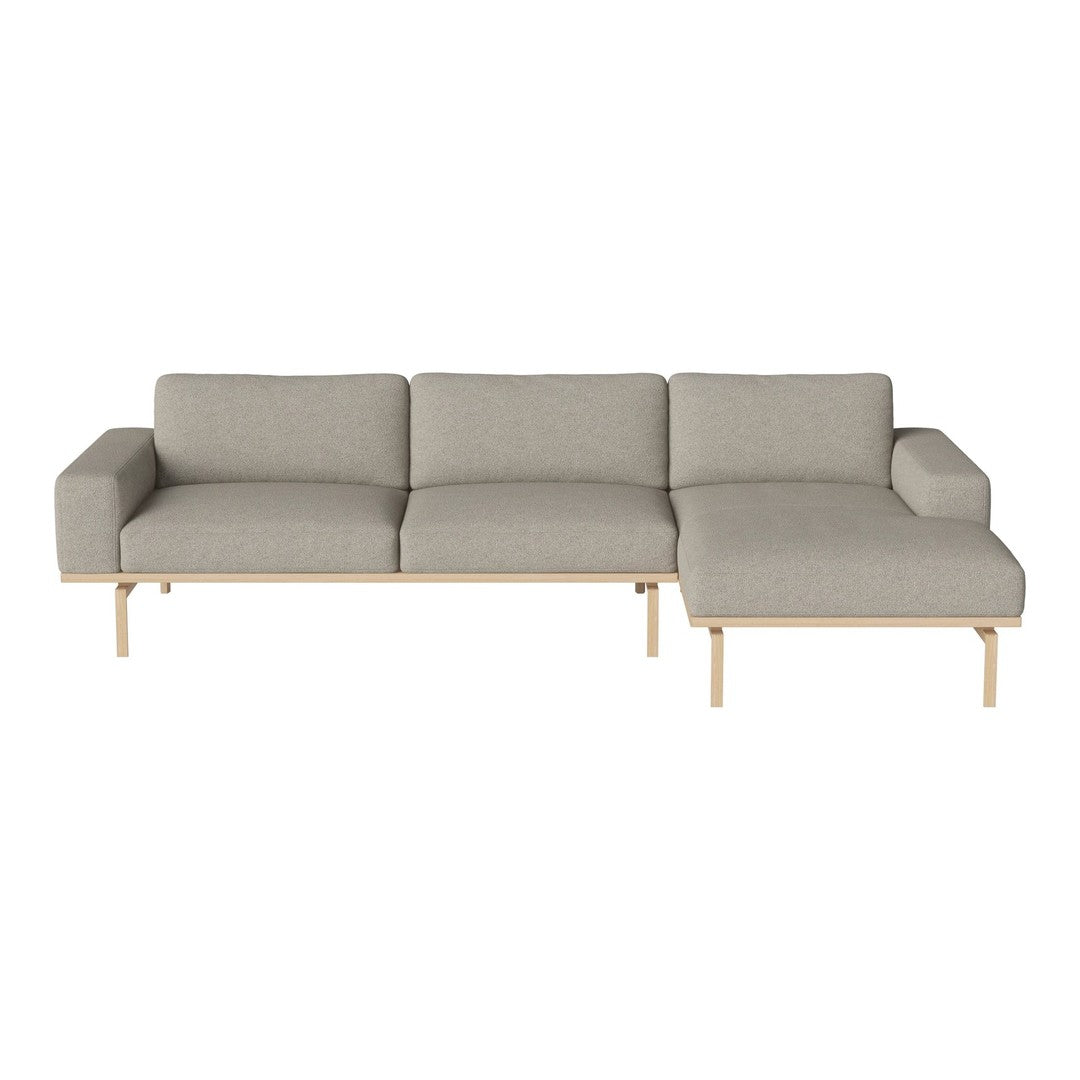 Light gray fabric sectional sofa with clean lines and natural wood legs, offering a modern and minimalist design.