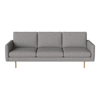 Modern gray sofa with clean lines and a minimalist design, featuring three plush cushions and light wood legs.
