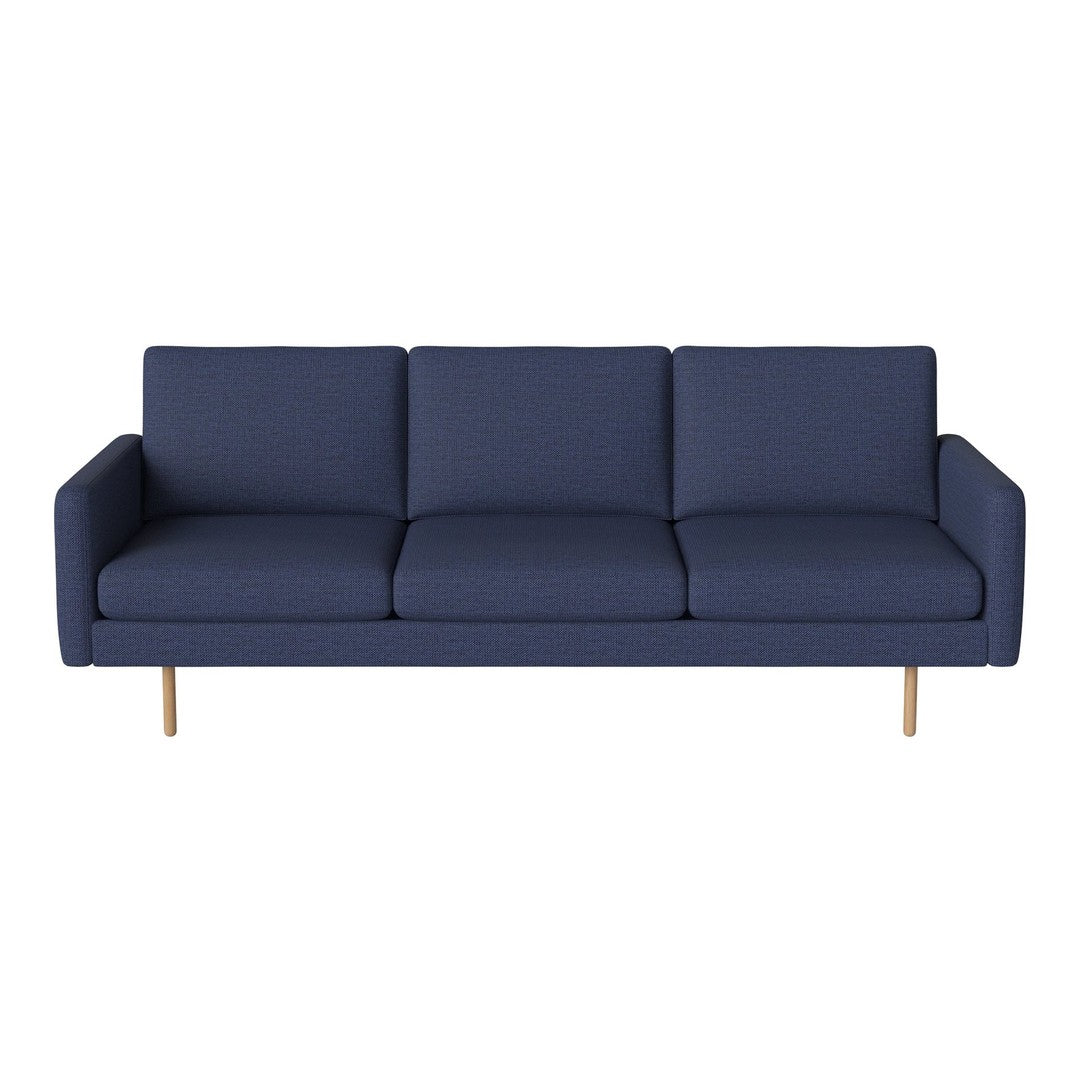 Navy blue modern sofa with clean lines and subtle texture, featuring light wood legs for a contemporary touch.
