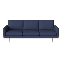 Navy blue modern sofa with clean lines and subtle texture, featuring light wood legs for a contemporary touch.
