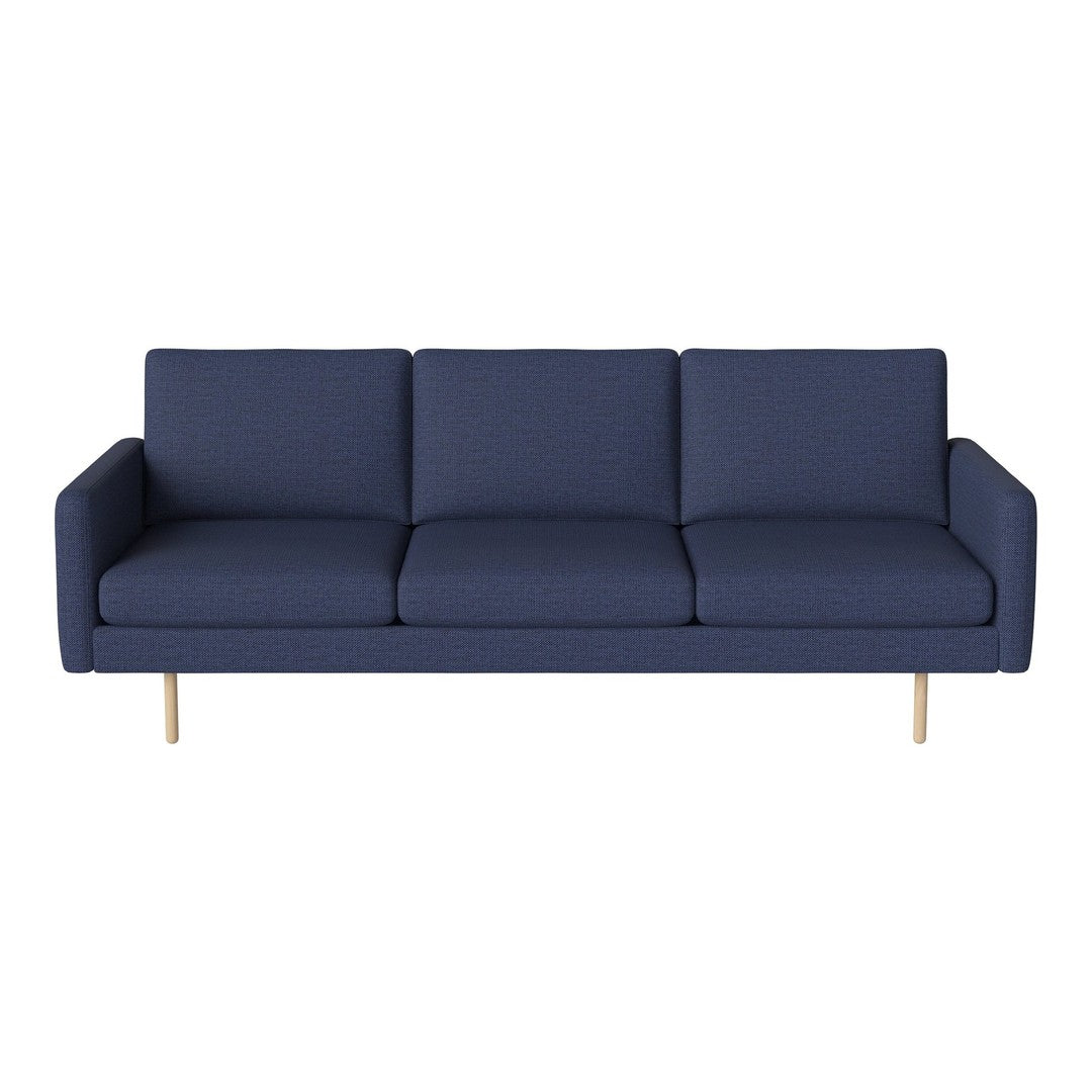 Navy blue modern sofa with clean lines and minimalistic design, featuring solid light wood legs.