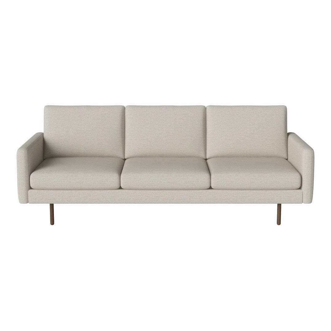 Light beige sofa with a minimalist design, featuring smooth, solid upholstery and sleek metal legs.