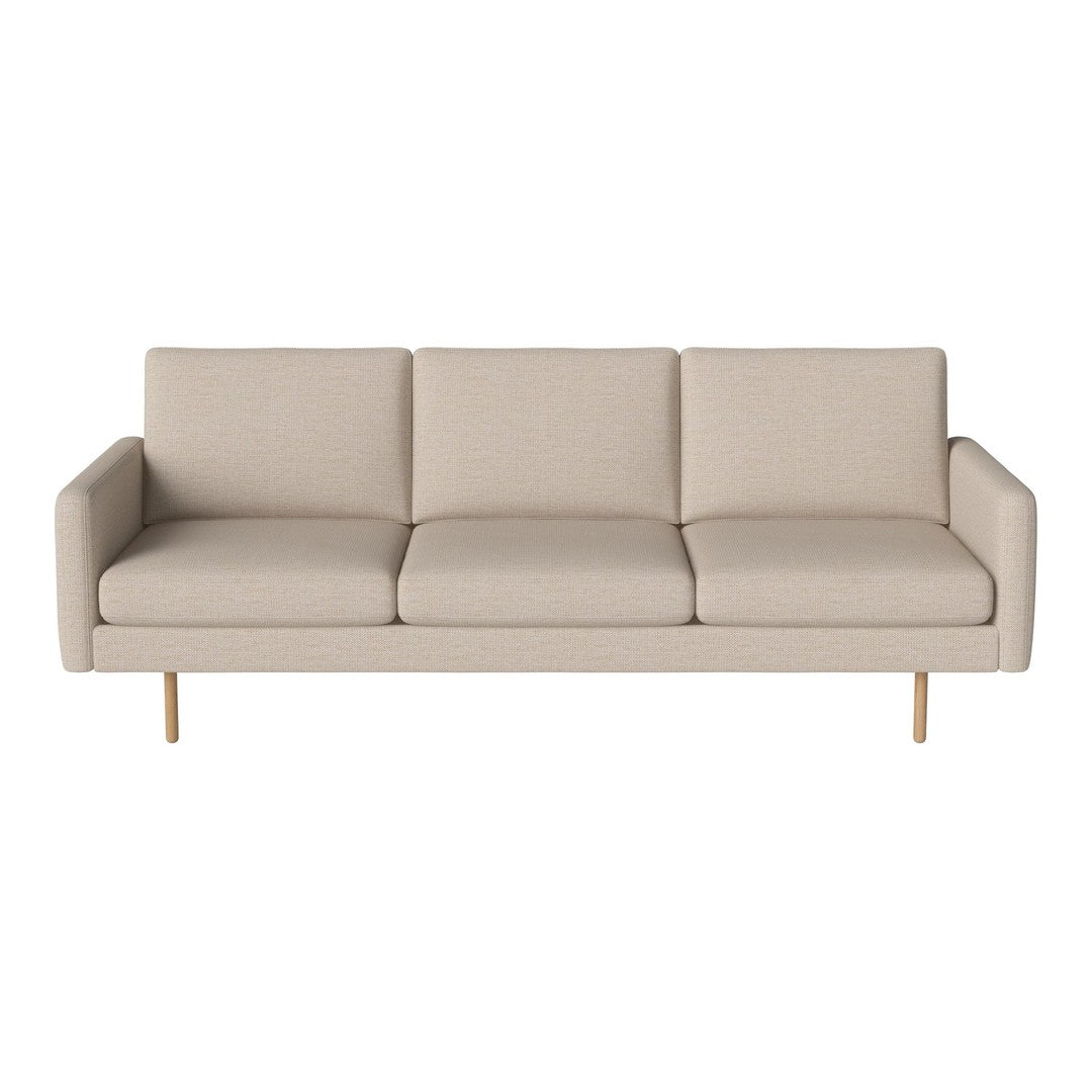 Light beige sofa with a minimalist design, featuring smooth upholstery and clean lines, complemented by wooden legs.