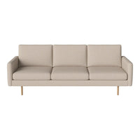 Light beige sofa with a minimalist design, featuring smooth upholstery and clean lines, complemented by wooden legs.