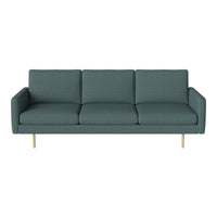 Teal upholstered sofa with a textured finish and minimalist wooden legs, perfect for modern living spaces.