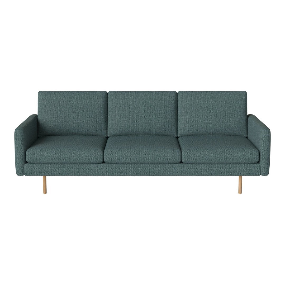 Teal upholstered sofa with a textured pattern and light wooden legs, adding a modern touch to any living space.