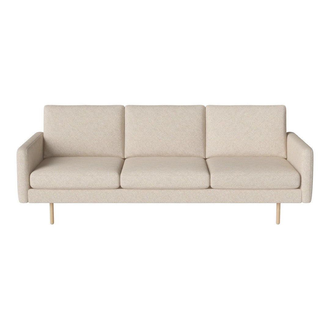 Cream-colored mid-century modern sofa with a simple, textured pattern and golden metal legs.