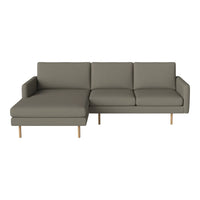 Modern gray sectional sofa with clean lines and minimalist design, featuring solid wood legs and cushioned seating.