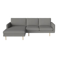 Modern gray sectional sofa with minimalist design and clean lines, featuring solid wood legs. Perfect for contemporary decor.