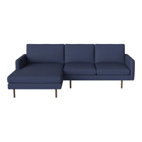 Navy blue fabric sectional sofa with a sleek modern design and clean lines, featuring solid-color upholstery.