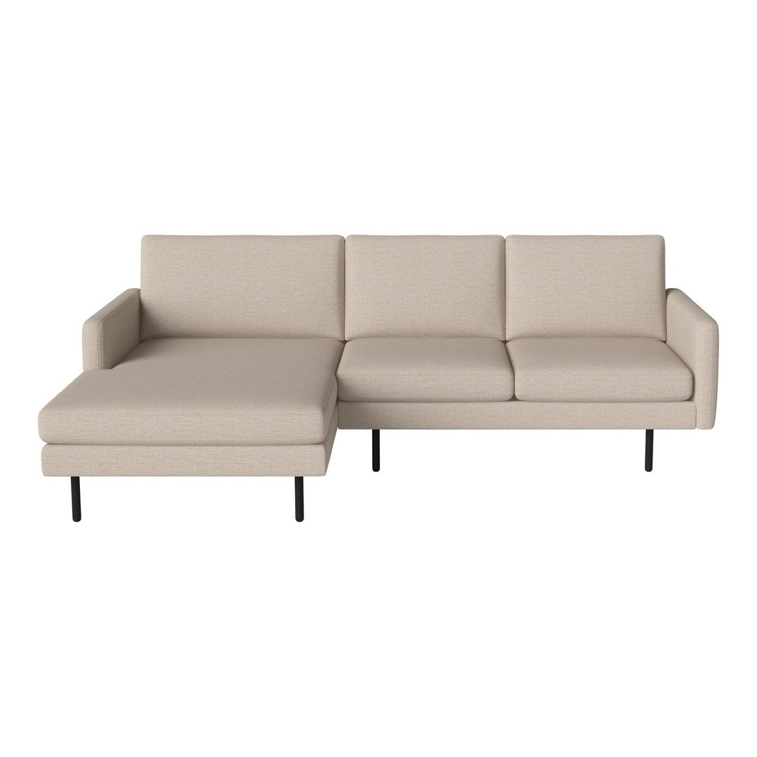 Beige sectional sofa with clean lines and minimalist design, featuring smooth upholstery and black metal legs.