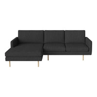 Gray sectional sofa with clean lines and minimalist design, featuring a stylish dark fabric and light wood legs.
