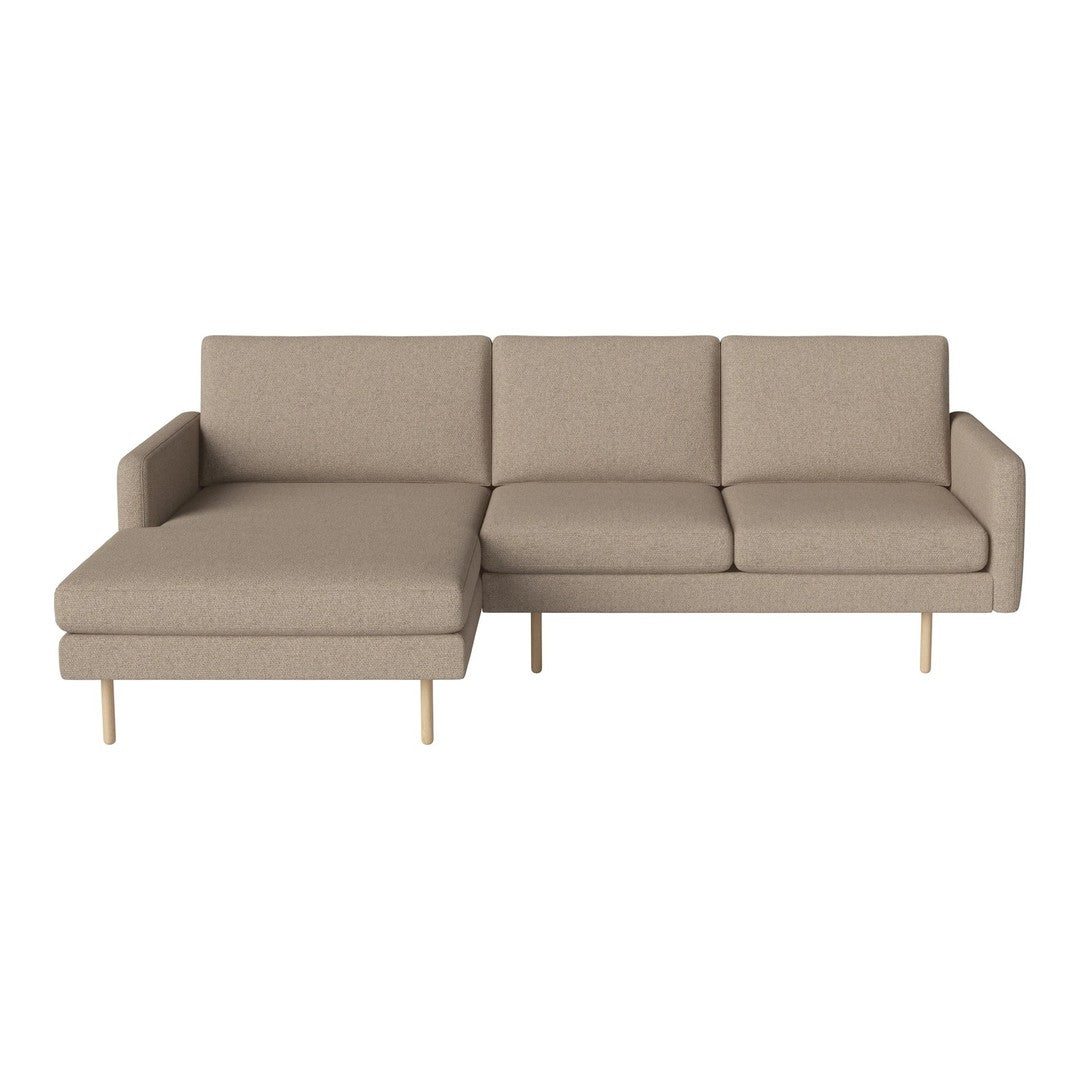 Tan fabric sectional sofa with clean lines and light wood legs, featuring a minimalist design for modern interiors.