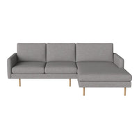 Gray fabric sectional sofa with clean lines and wooden legs. Modern, minimalist design perfect for contemporary decor.