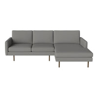 Modern gray sectional sofa with a sleek design and subtle texture, featuring gold metal legs for a stylish touch.