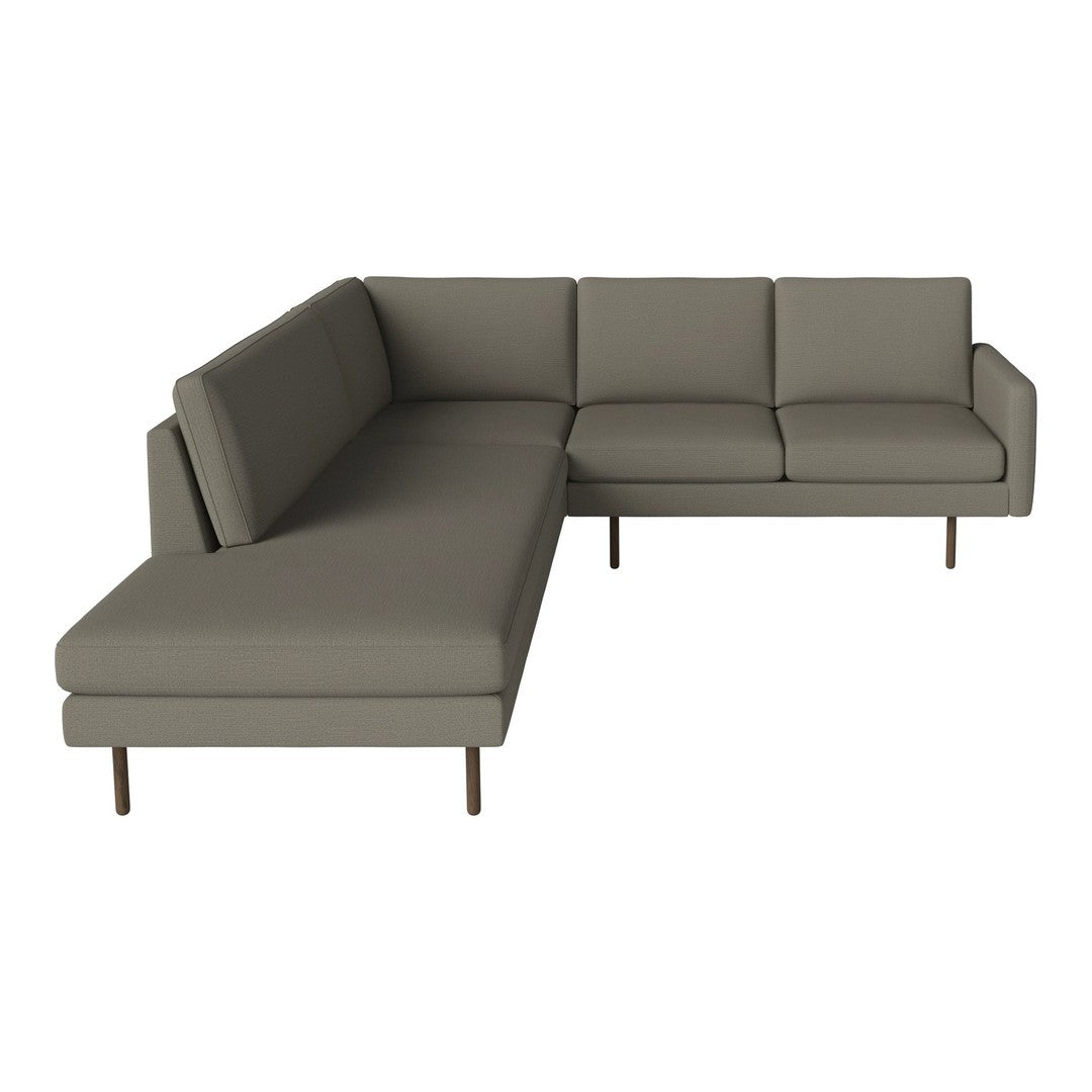 Modern L-shaped sofa in soft, neutral gray fabric with clean lines and subtle texture. Ideal for minimalist decor.