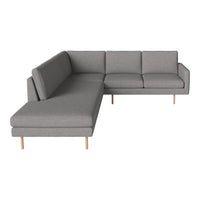 Gray sectional sofa with a modern design and clean lines, featuring smooth upholstery and wooden legs.