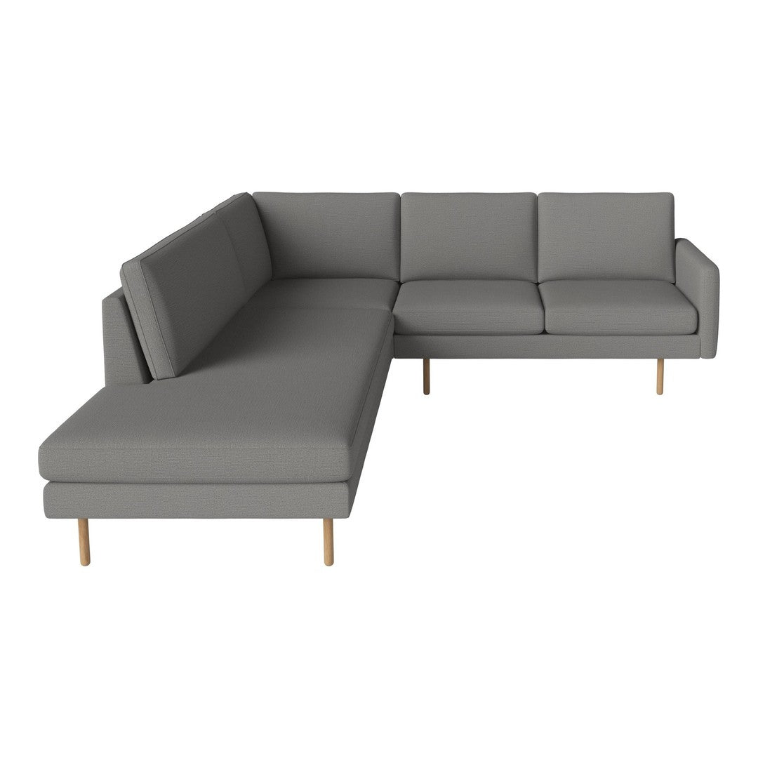 Gray sectional sofa with clean lines and minimalist design, featuring solid fabric and wooden legs.