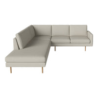 Light gray sectional sofa with clean lines and wooden legs, featuring a smooth, solid pattern. Ideal for modern decor.