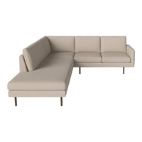 Beige sectional sofa with a minimalist design and clean lines, featuring a soft, textured fabric.
