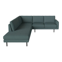Teal sectional sofa with a modern design and textured fabric, featuring a sleek, minimalistic silhouette.