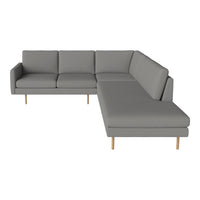 Gray sectional sofa with clean lines and subtle texture, featuring light wooden legs for a modern touch.