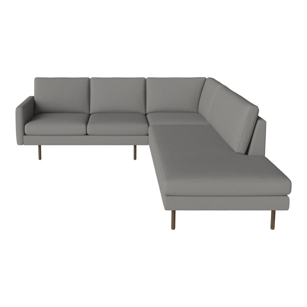 Gray sectional sofa with a sleek, minimalist design and soft upholstery. Ideal for modern living spaces.