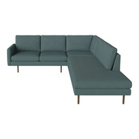 Teal sectional sofa with a smooth, solid pattern and sleek wooden legs, perfect for modern living spaces.