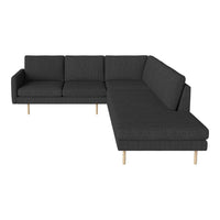 Modern gray sectional sofa with a textured fabric and natural wood legs, offering a sleek and minimalist design.