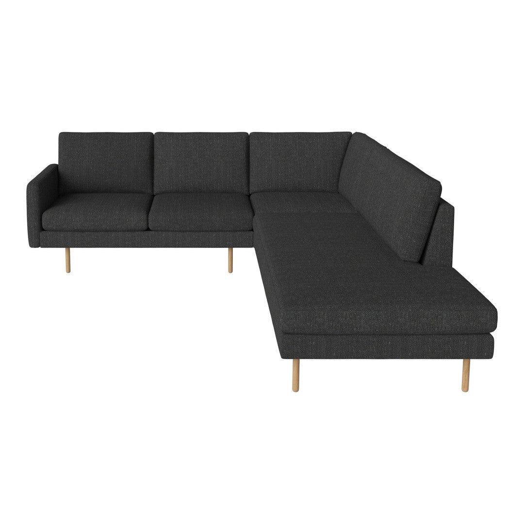 Dark grey sectional sofa with modern design and light wooden legs, showcasing a sleek, minimalist pattern.