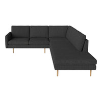 Dark grey sectional sofa with modern design and light wooden legs, showcasing a sleek, minimalist pattern.
