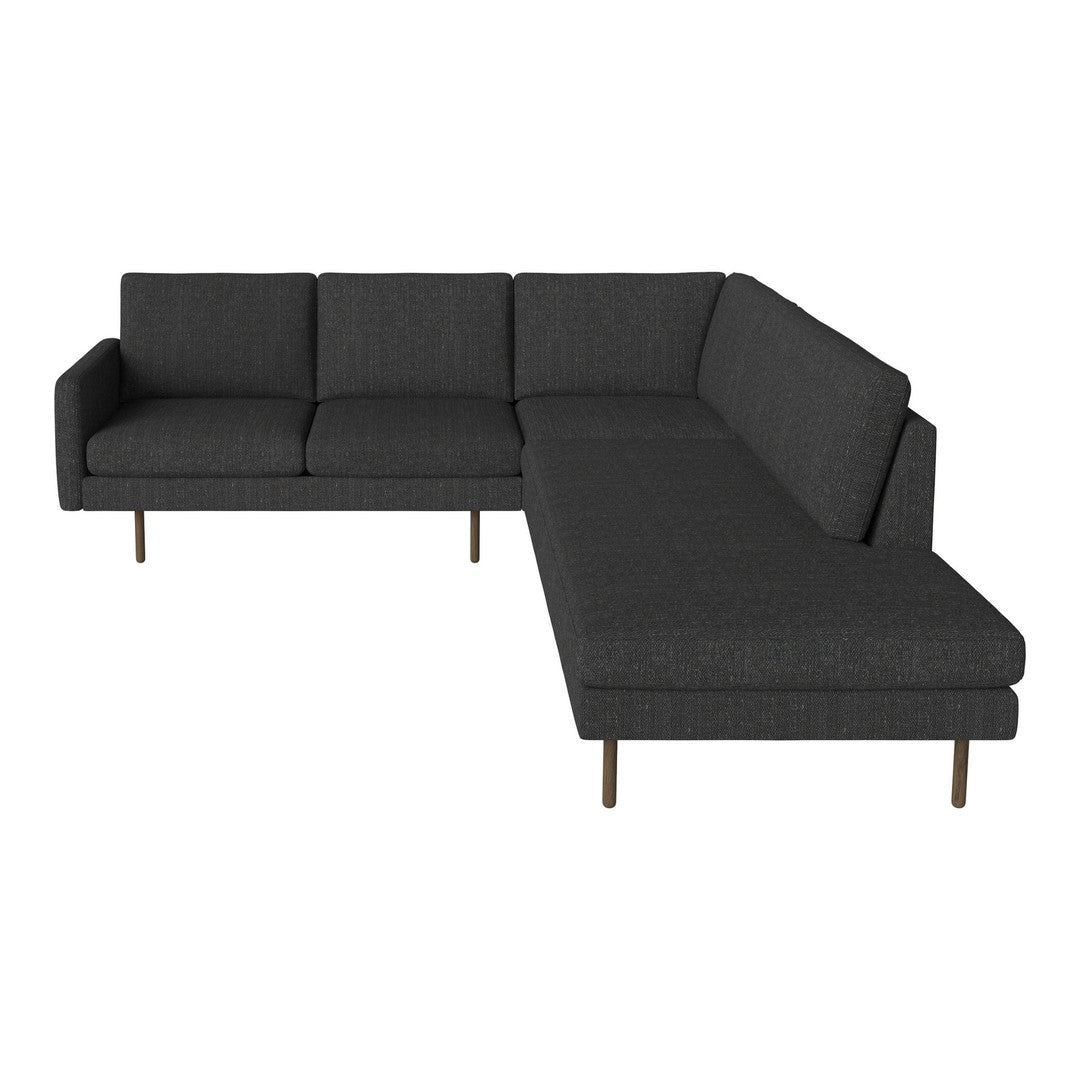 Modern L-shaped sofa in dark gray fabric with clean lines and minimalistic design, featuring wooden legs.