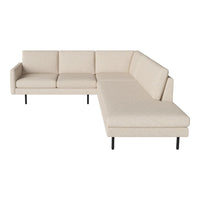 Beige sectional sofa with a smooth, textured fabric and sleek black legs, perfect for modern living spaces.