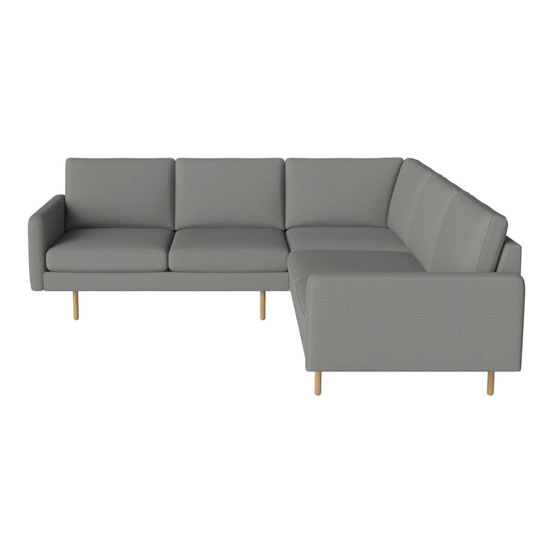 Gray sectional sofa with clean lines, minimalist design, and light wood legs. Ideal for modern living spaces.