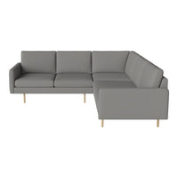 Light gray sectional sofa with simple, modern lines and natural wooden legs. Perfect for contemporary decor.