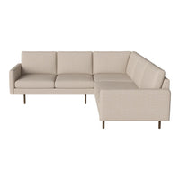 Beige sectional sofa with smooth fabric texture and minimalist design, featuring subtle stitching details.