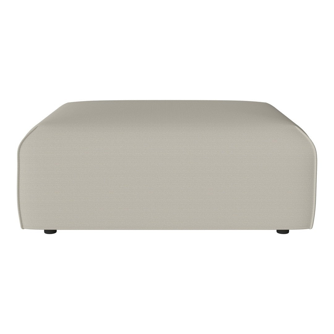 Beige upholstered ottoman with smooth, minimalist design and subtle texture. Perfect for modern decor.