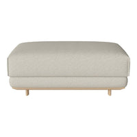 Light gray upholstered ottoman with a smooth texture and minimalist wooden legs, perfect for modern decor.