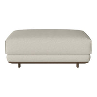 Beige upholstered ottoman with a smooth texture and a sturdy wooden base. Simple and modern design for versatile decor.
