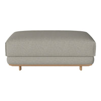 Gray upholstered ottoman with subtle texture, featuring a minimalist design and light wood legs.