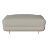 Light gray upholstered ottoman with a textured pattern and wooden legs, perfect for modern decor.