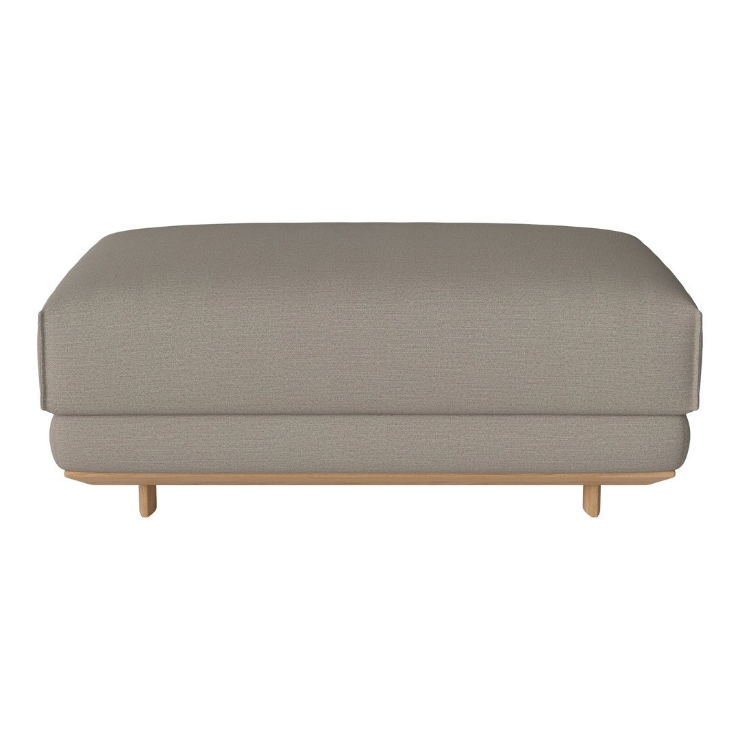 Light grey upholstered ottoman with a smooth finish and minimalist wooden legs. Simple, modern design.
