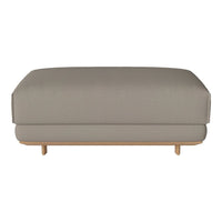 Light grey upholstered ottoman with a smooth finish and minimalist wooden legs. Simple, modern design.