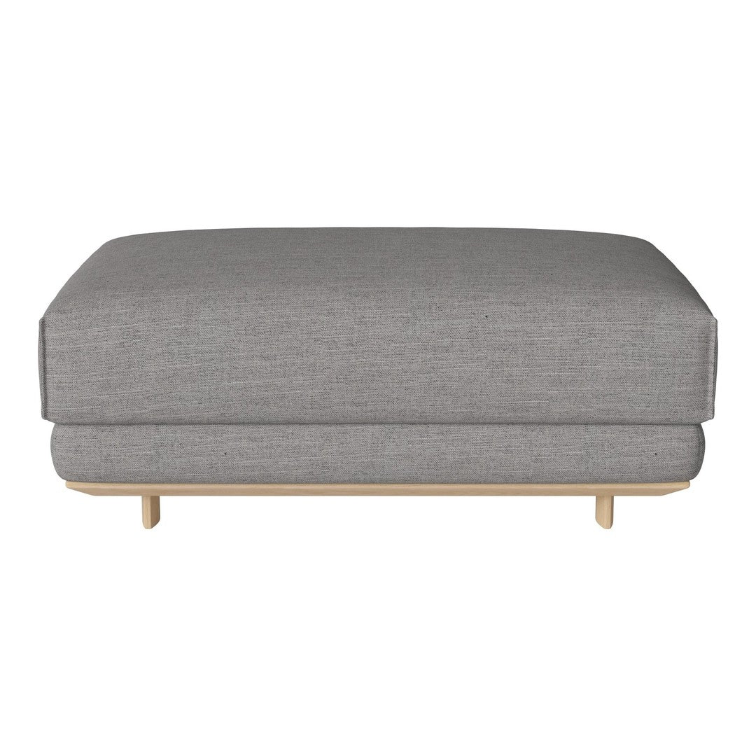 Gray upholstered ottoman with a textured fabric and natural wood legs. Modern, minimalist design for versatile decor.