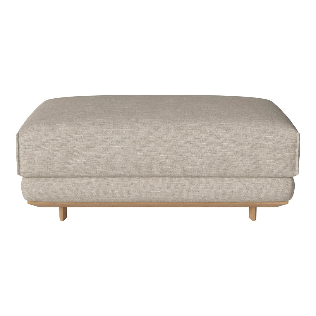 Light beige upholstered ottoman with a smooth texture and simple, contemporary design.