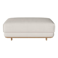 Elegant cream ottoman with a smooth texture and minimalist design, featuring a natural wood base for a modern touch.