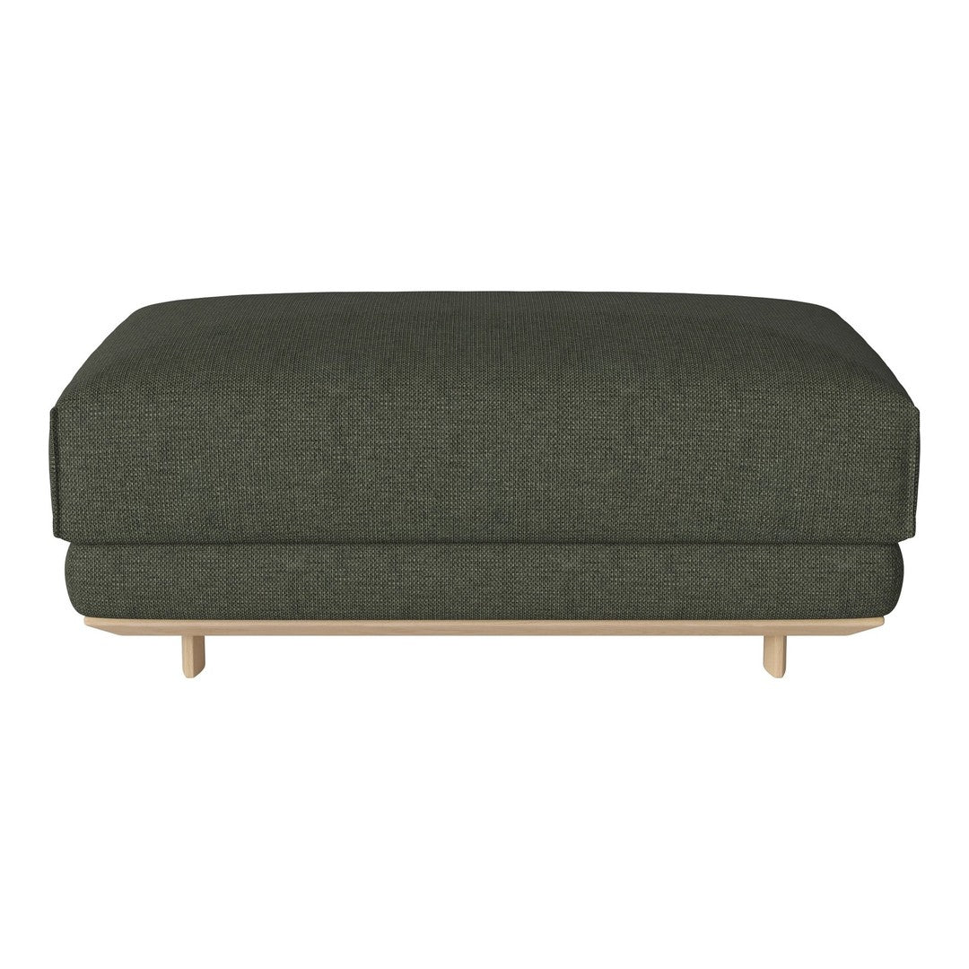Dark green upholstered ottoman with subtle textured pattern, featuring a light wood base.